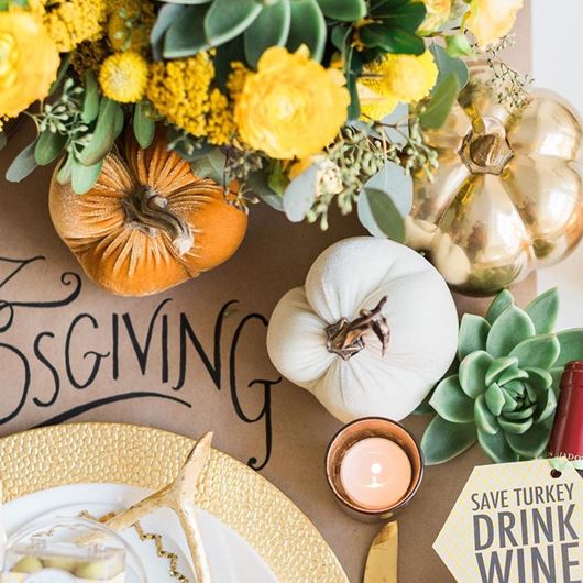 Rustic Thanksgiving tablescape made complete with pumpkins and succulents.